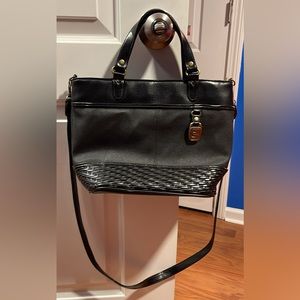 Black leather Capezio bag. Measuring: 9L X 12W.